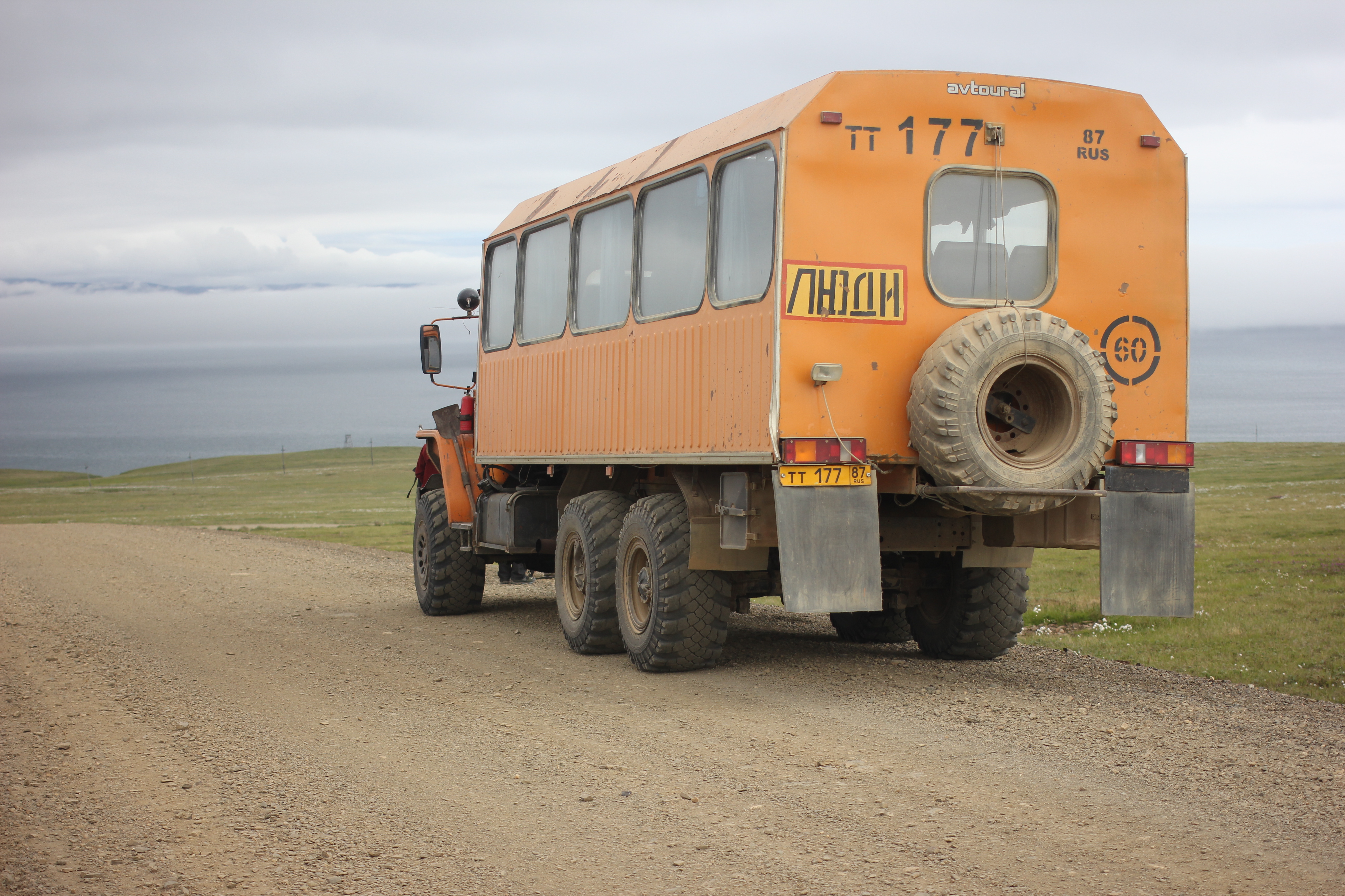 The six-wheel bus that travels between Lorino and Lavrentiya, Chukotka, July 2016. Roads in the region are rare and mostly unpaved, making overland travel difficult on all but the largest tires. (Kirsten Swann / Alaska Dispatch News)