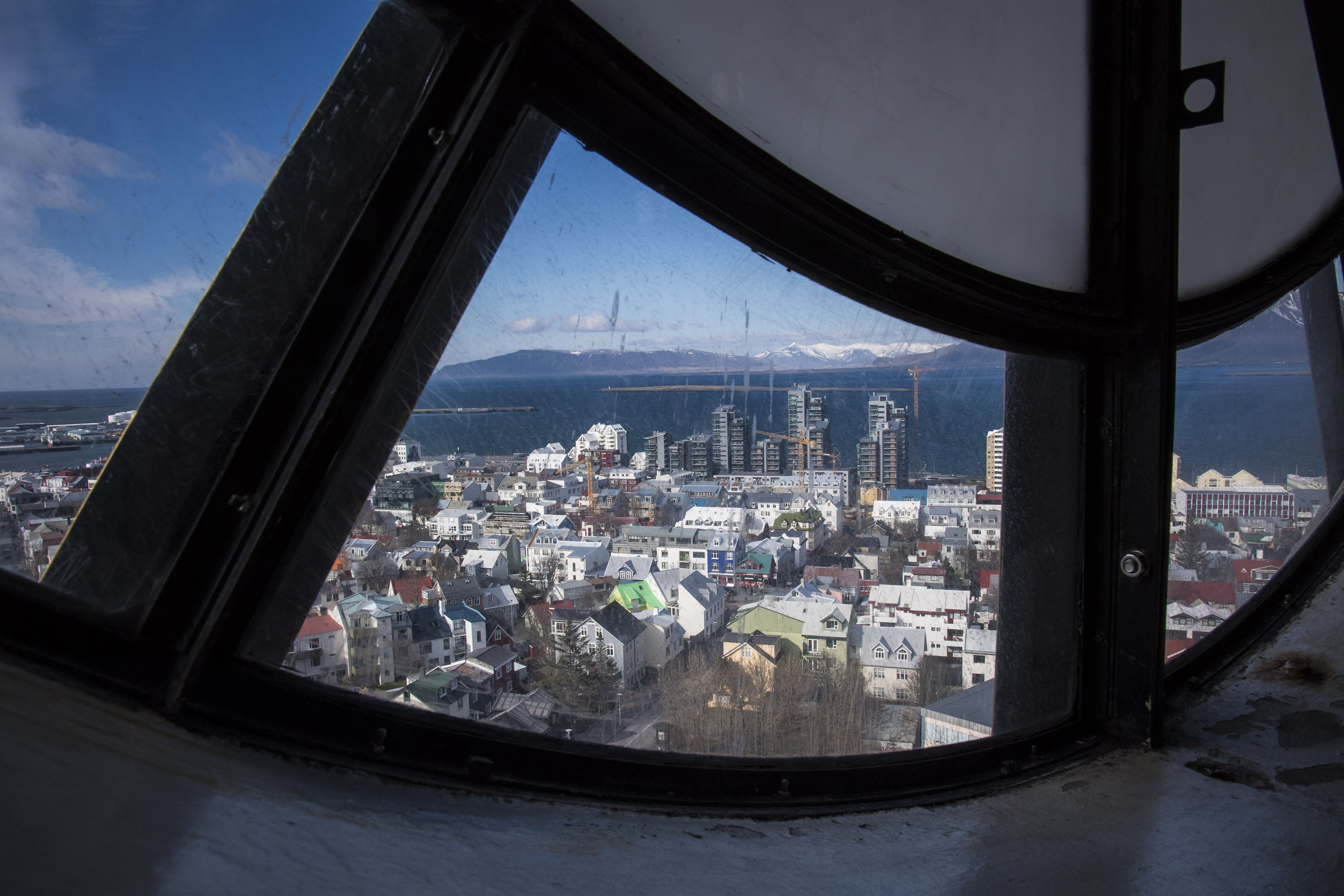 The view of buildings in downtown Reykjavík are seen from the top of Hallgrímskirkja, a Lutheran church which is also the national church of Iceland, on April 27. More than 60 percent of the country's population lives in or near by the coastal capital city. (Jabin Botsford / The Washington Post)