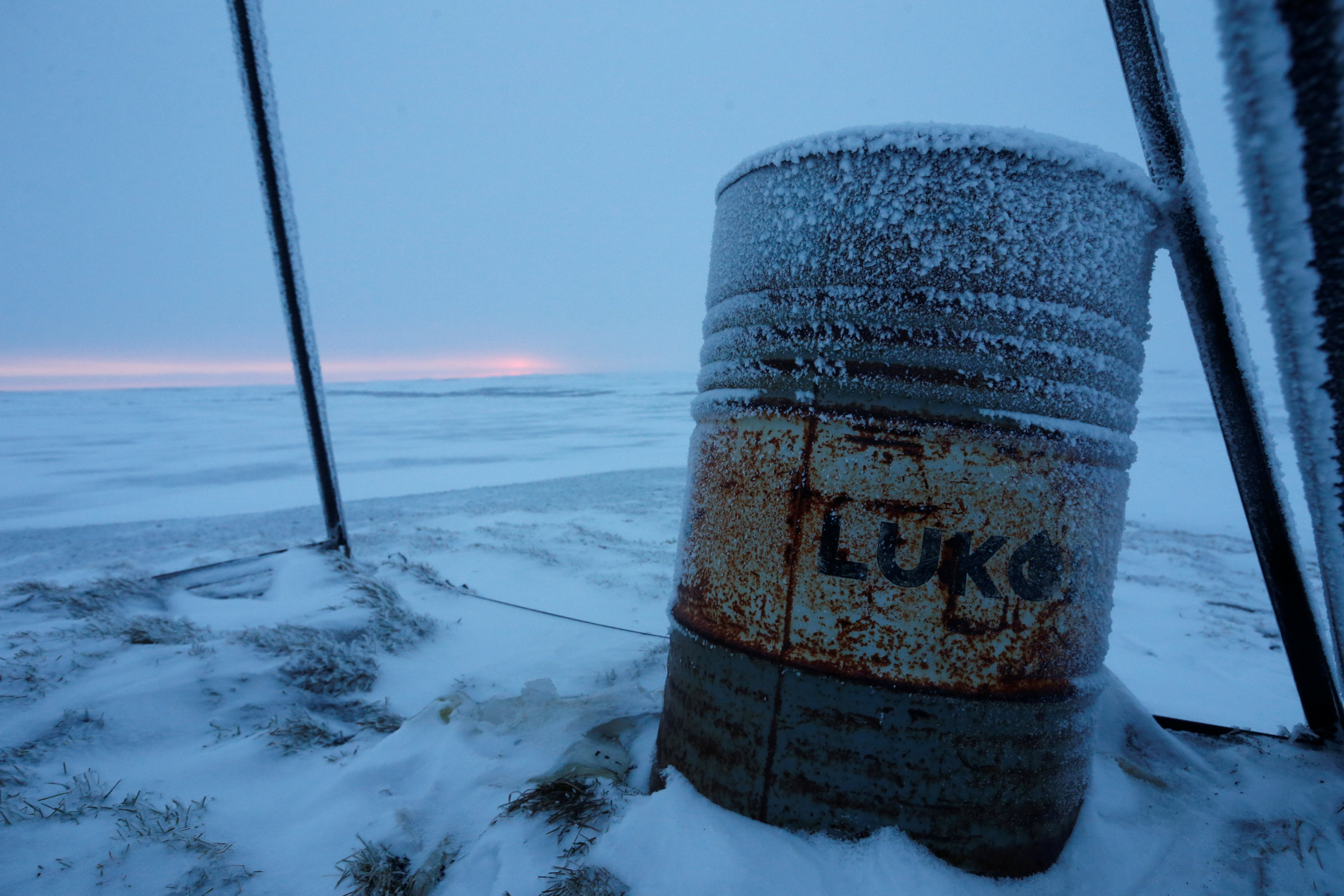 A barrel with a sign "Lukoil" is seen in the tundra area in Nenets Autonomous District, Russia, November 26, 2016. Picture taken November 26, 2016. REUTERS/Sergei Karpukhin       