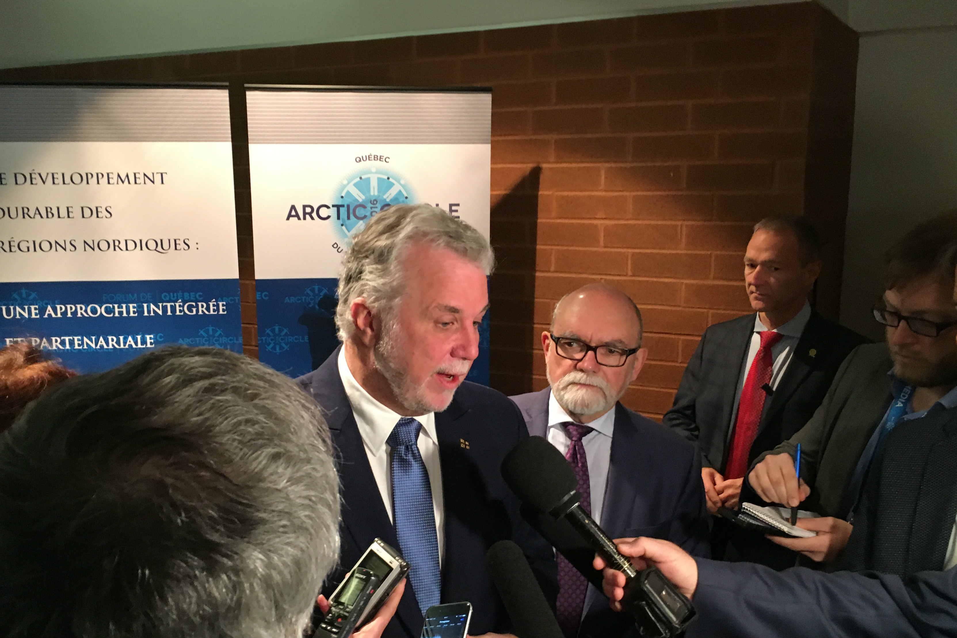 Quebec Premier Philippe Couillard answers questions from media at an Arctic Circle Forum event in Quebec City, Quebec, Dec. 12, 2016. (Krestia DeGeorge / Arctic Now)