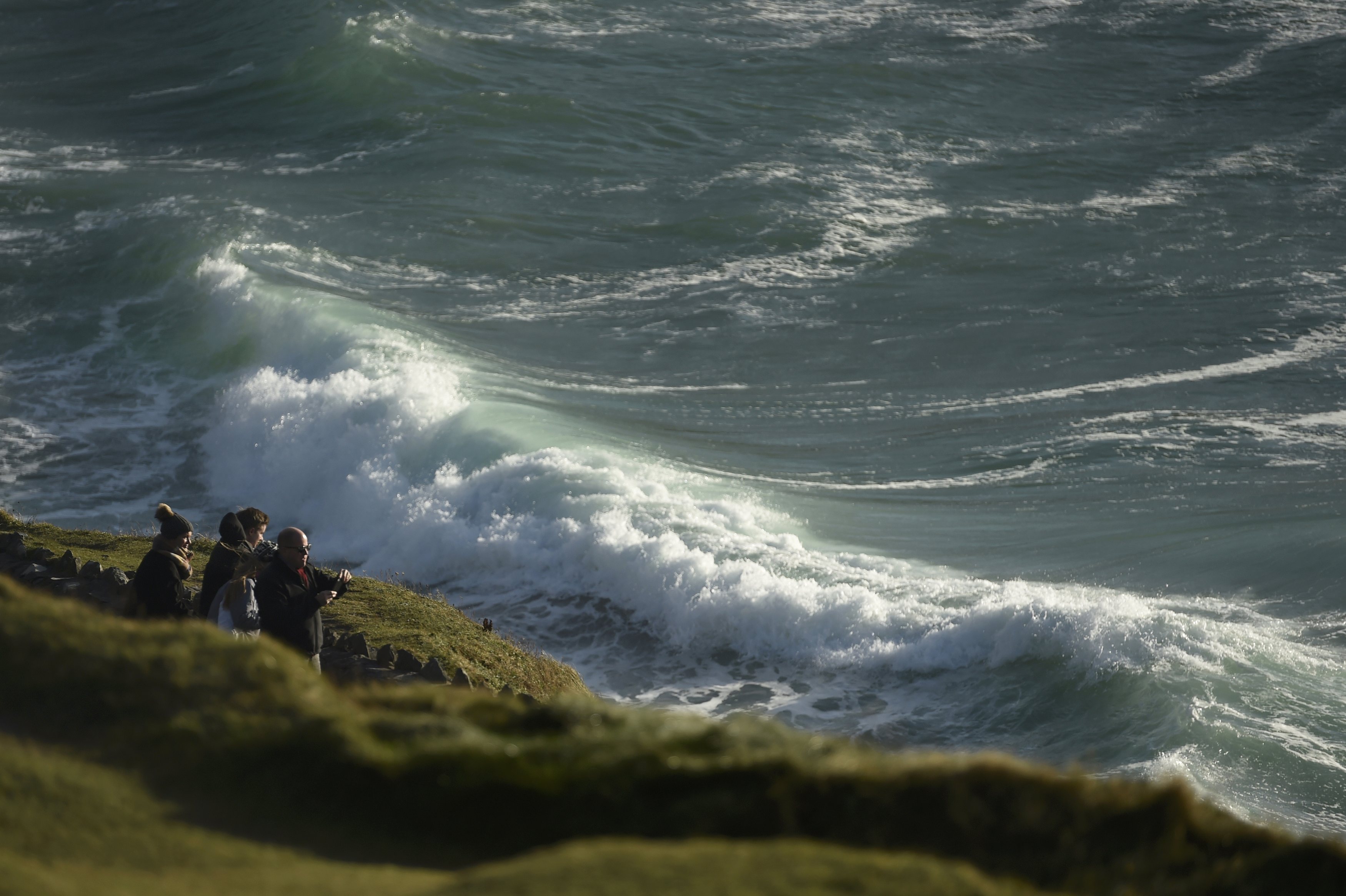 People look out to the Atlantic ocean from Slea Had in Ventry, Ireland December 27, 2016. REUTERS/Clodagh Kilcoyne