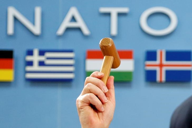NATO Secretary-General Jens Stoltenberg holds up a ceremonial hammer at the start of a NATO-Georgia defence ministers meeting at the Alliance headquarters in Brussels, Belgium February 16, 2017. (Francois Lenoir / Reuters)