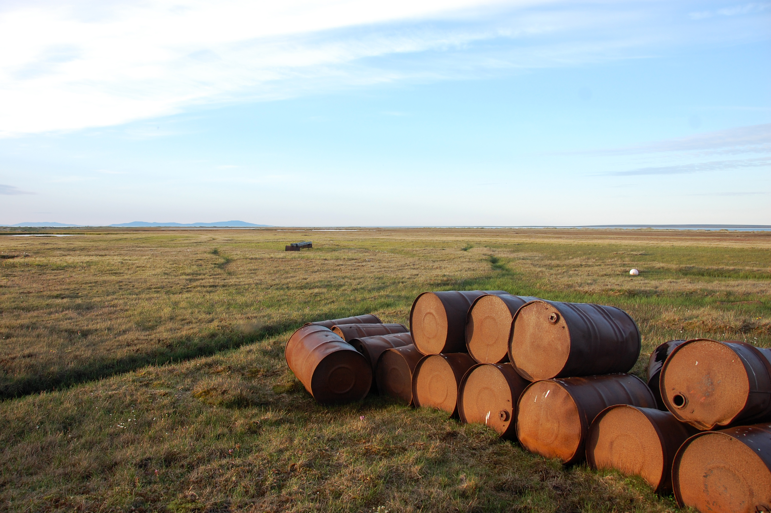 Abandoned oil drums on the tundra at Chenkul Island in Chukotka, Russia. (Getty)
