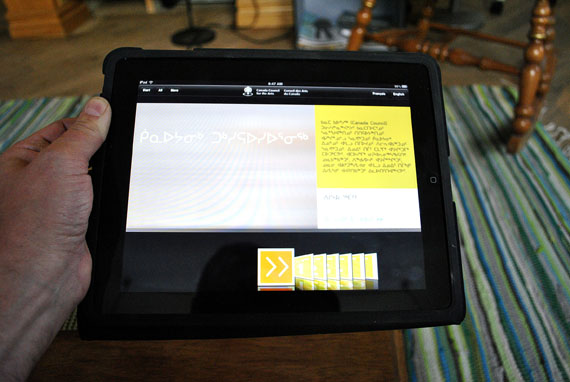 An Iqaluit iPad user looks at an app that displays Inuktut syllabics. The Toronto-based researcher, Ian Martin, says the use of the Inuit language at home in Nunavut is declining so rapidly, only 4 percent of Inuit may be using Inuktut at home by 2051.  (Nunatsiaq News file photo)