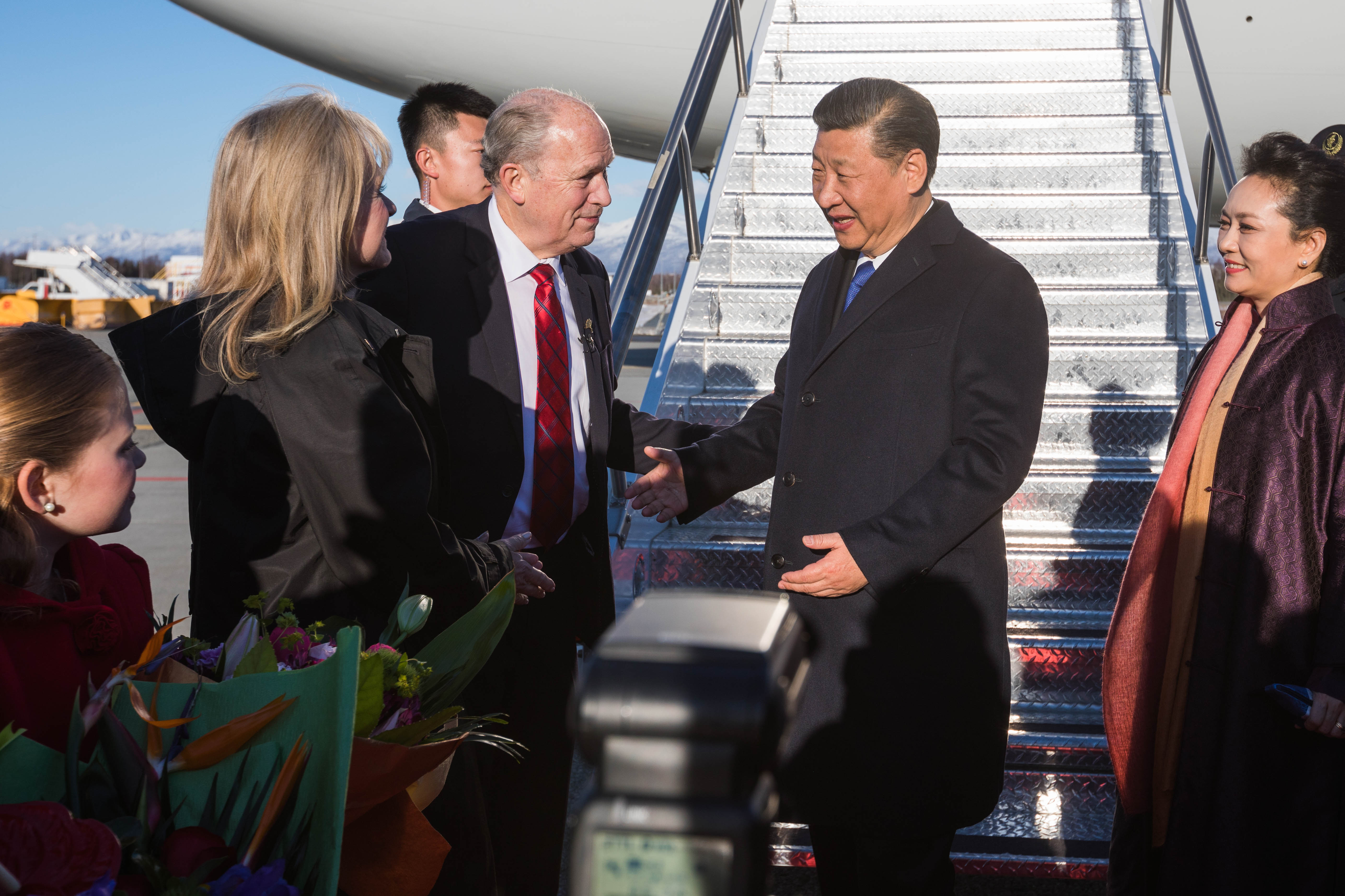 Gov. Bill Walker greets Chinese President Xi Jinping and his wife Peng Liyuan after they landed in Anchorage Friday, April 7, 2017. (Loren Holmes / Alaska Dispatch News)