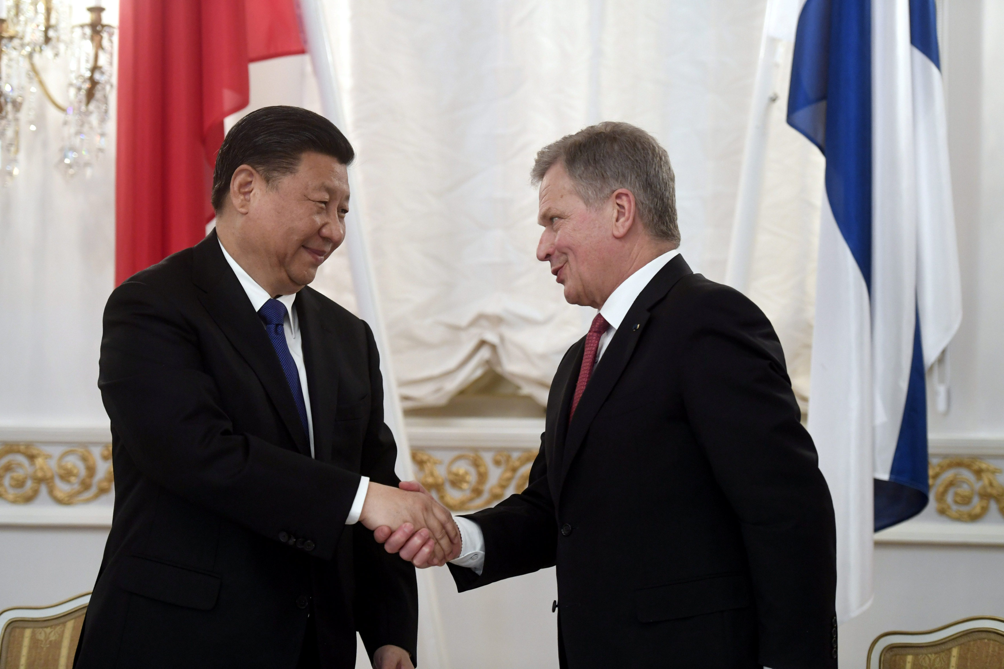 China's President Xi Jinping and Finland's President Sauli Niinisto shake hands during the signing ceremony at the Presidential Palace in Helsinki, Finland April 5, 2017. Lehtikuva/Vesa Moilanen/via REUTERS
