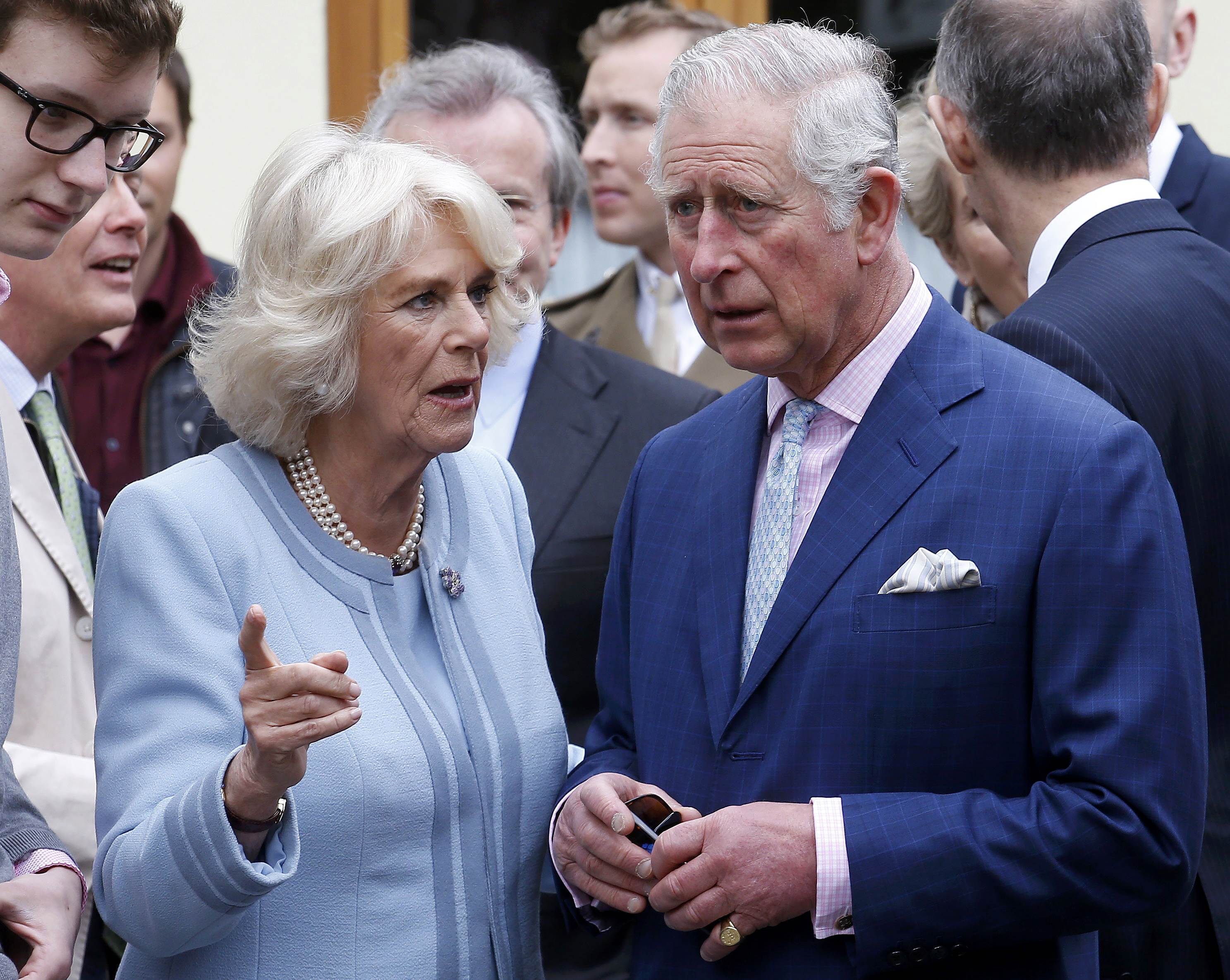 Britain's Prince Charles listens to his wife Camilla, Duchess of Cornwall, as they visit a traditional wine tavern in Vienna, Austria, April 6, 2017. (Heinz-Peter Bader / Reuters)