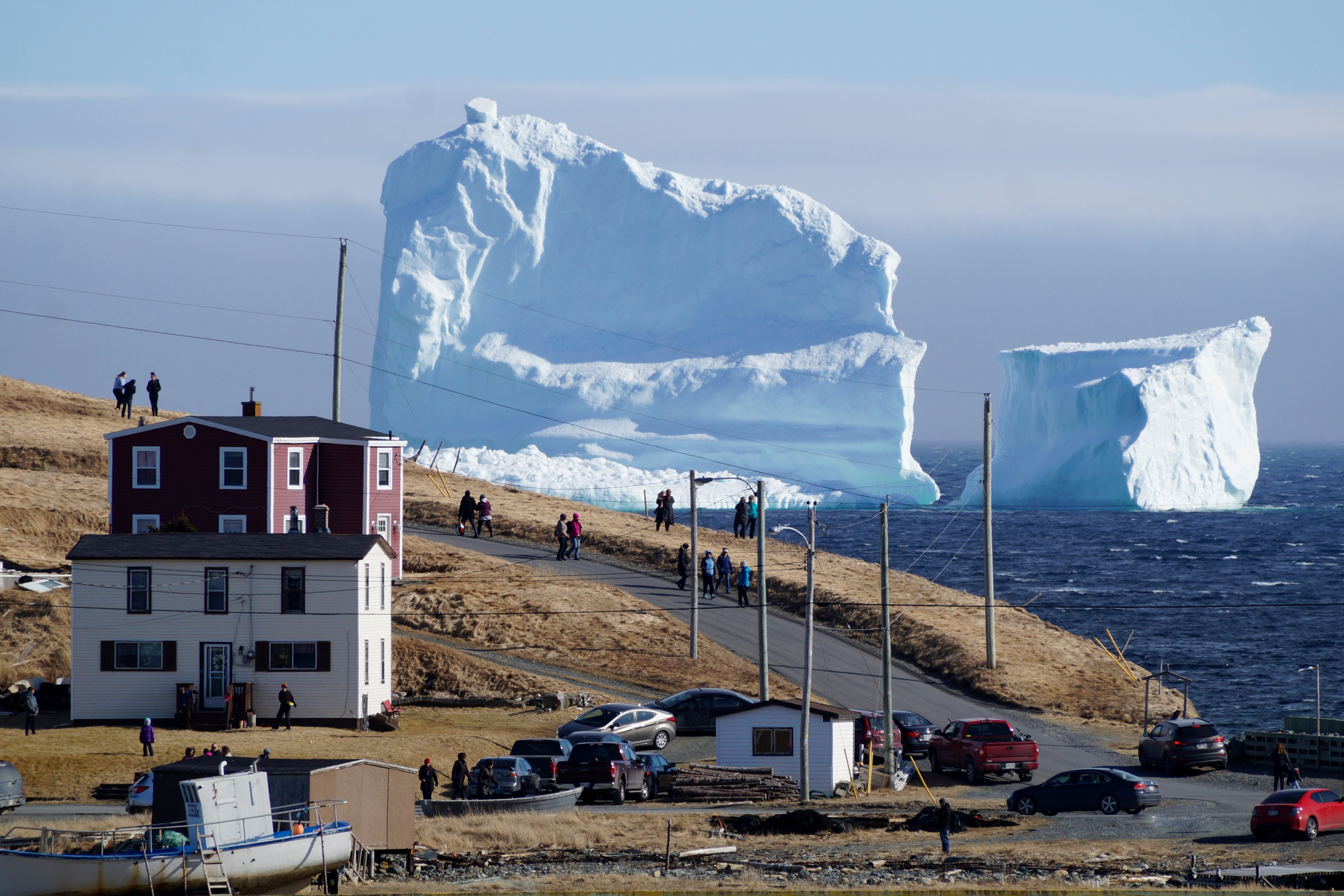 Residents view the first iceberg of the season as it passes the South Shore, also known as "Iceberg Alley", near Ferryland Newfoundland, Canada April 16, 2017. Picture taken April 16, 2017. (Jody Martin / Reuters file photo)