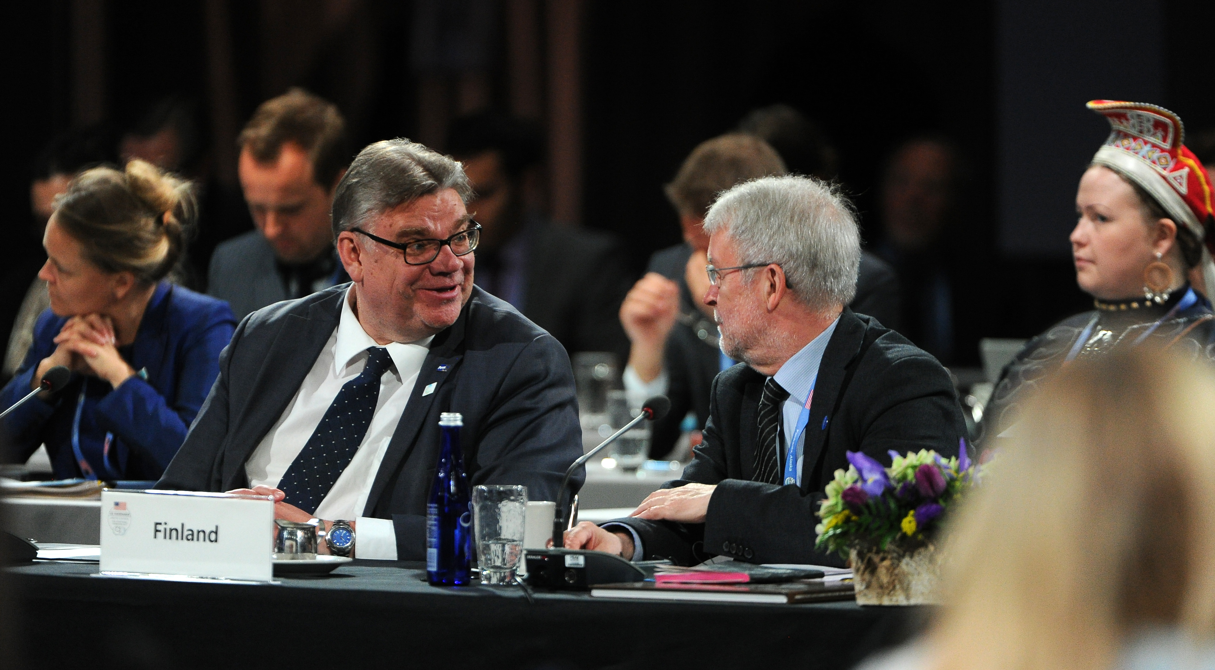 Minister of Foreign Affairs of Finland, Timo Soini, speaks with a colleague before the gavel is passed to him by US Secretary of State Rex Tillerson at the Arctic Council Ministerial at the Carlson Center in Fairbanks, Alaska on Thursday, May 11, 2017. (Bob Hallinen / Alaska Dispatch News)