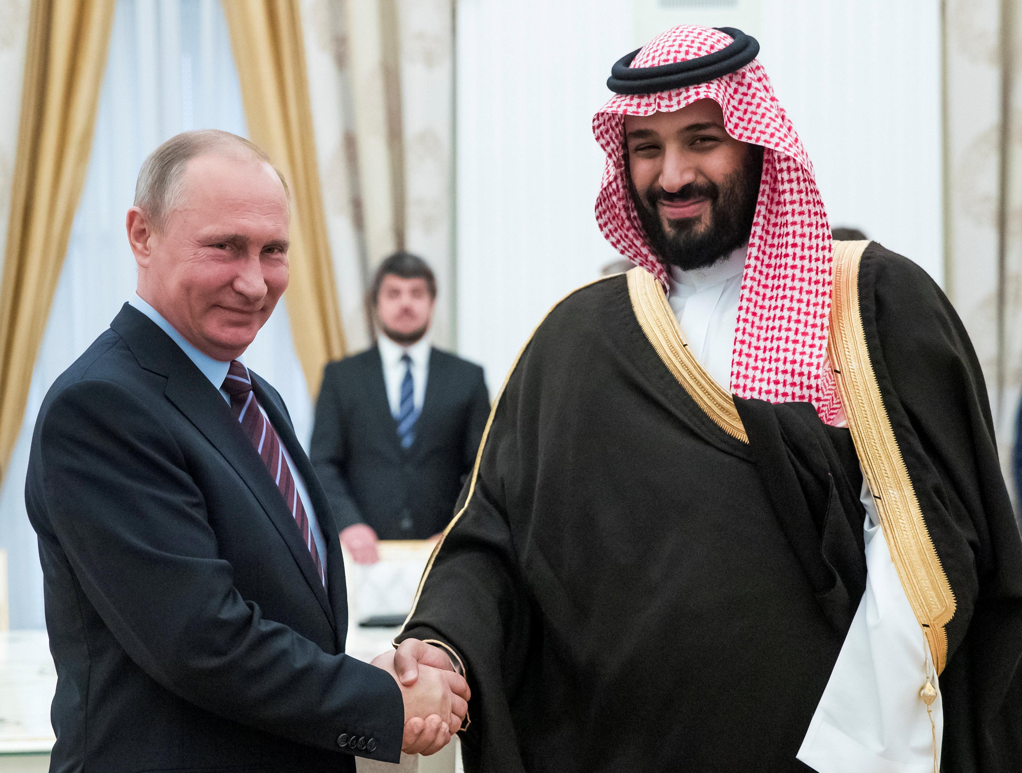 Russian President Vladimir Putin shakes hands with Saudi Deputy Crown Prince and Defence Minister Mohammed bin Salman during a meeting at the Kremlin in Moscow, Russia, May 30, 2017. REUTERS/Pavel Golovkin/Pool/File Photo