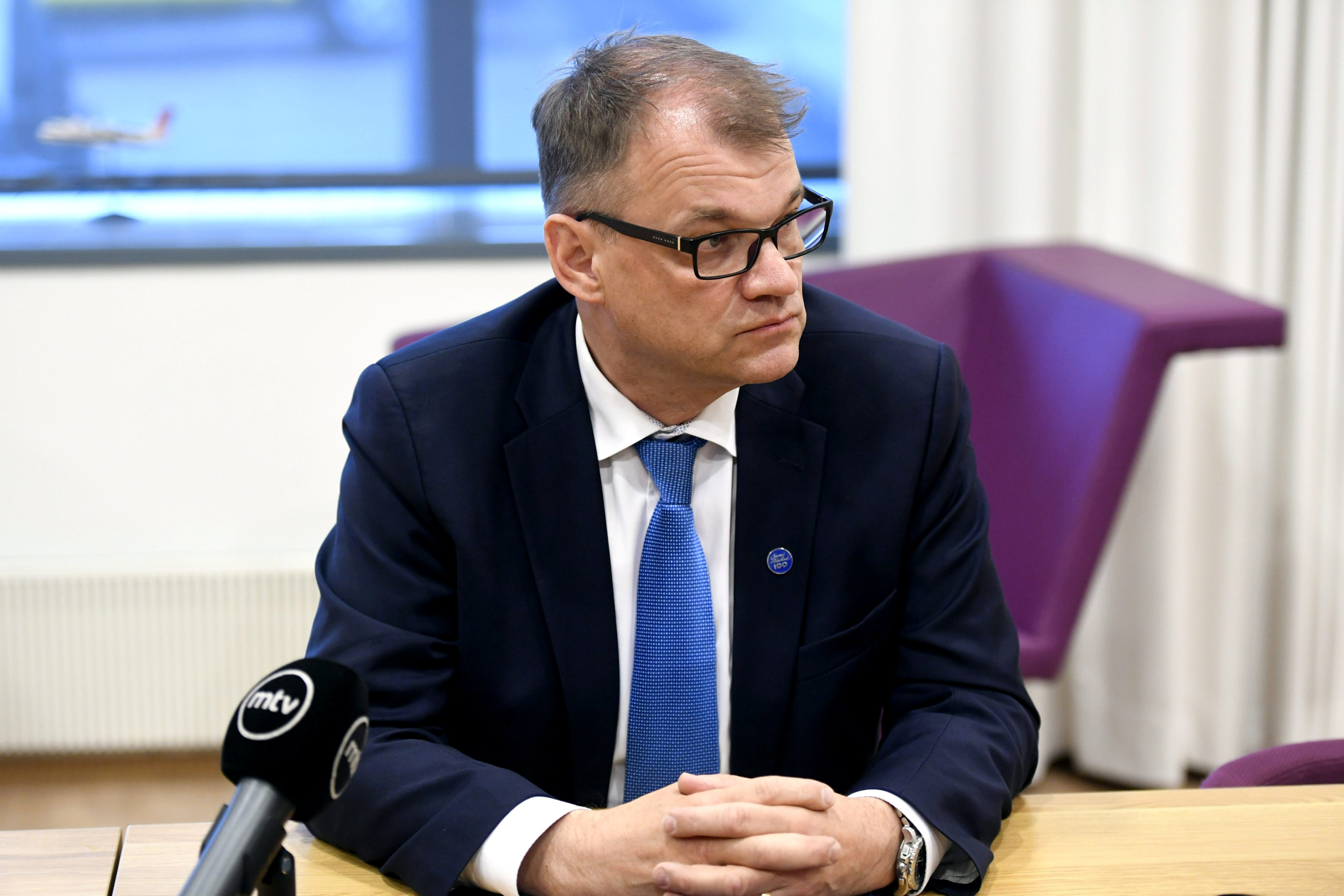 Finland's Prime Minister Juha Sipila (R) attends a news conference at the airport in Turku, Finland, June 13, 2017. (Lehtikuva/Heikki Saukkomaa/via Reuters)
