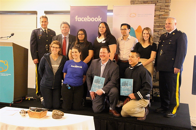 People representing the Government of Nunavut, Nunavut Tunngavik Inc., the Quality of Life Secretariat and the Embrace Life Council pose for a photo June 26 at the launch of a five-year suicide prevention action plan called Inuusivut Anninaqtuq, or United For Life.
