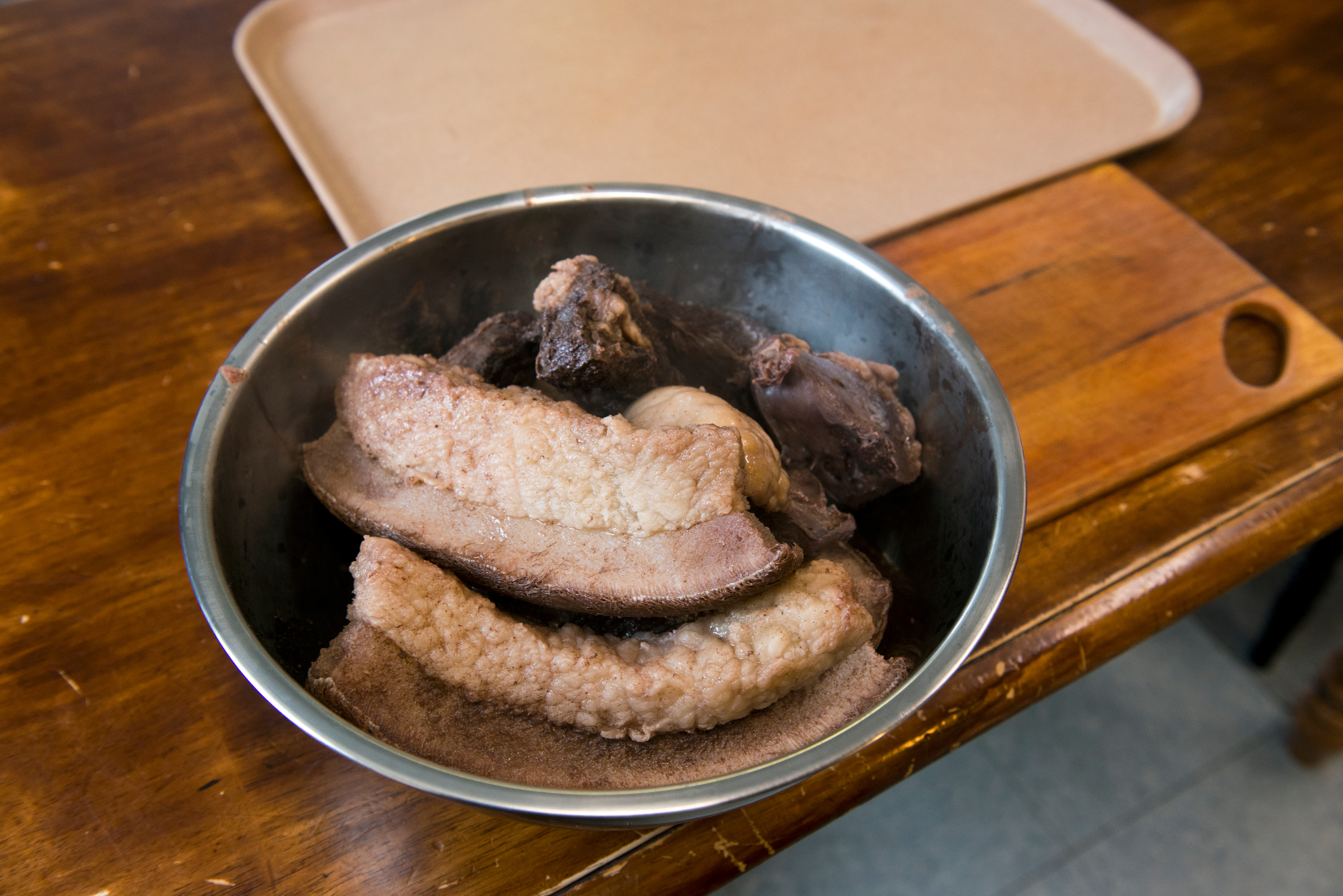 Boiled walrus skin, fat, meat and heart await cutting and serving. Rhona "Bunnie" Apassingok, prepared a meal of several different traditional subsistence foods for her 11-member household in Gambell on April 25, 2017. (Marc Lester / Alaska Dispatch News)