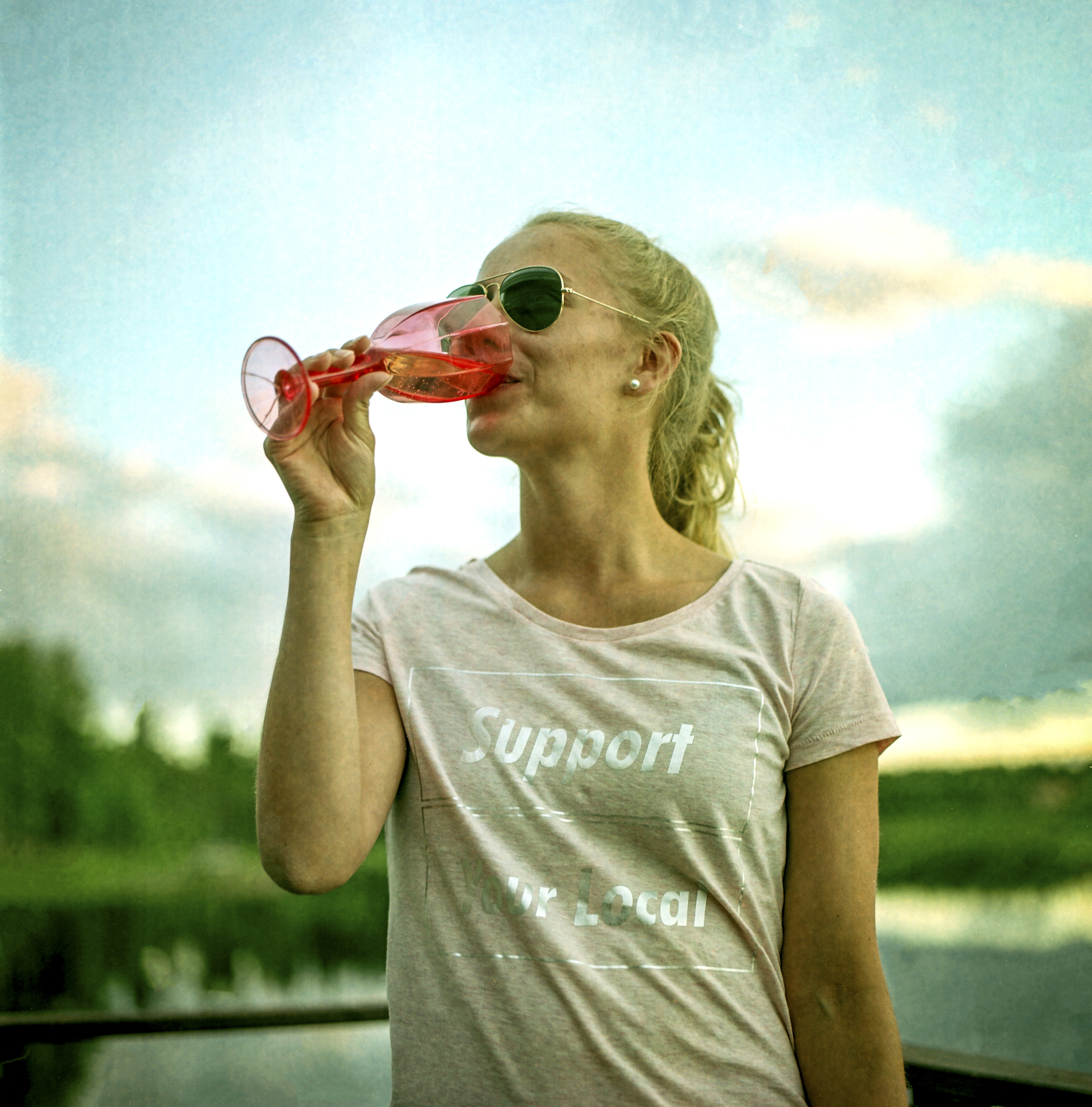 Petra Koskela sips wine at the Ukkohalla resort, where many participating in the Swamp Soccer World Championships stayed, in Hyrynsalmi, Finland, in July of 2017. More than 2,000 people ventured to the remote backwaters of central Finland recently for the 20th annual Swamp Soccer World Championships, further proof of the country's growing penchant for screwball sports competitions. (Janne Krkk/The New York Times)