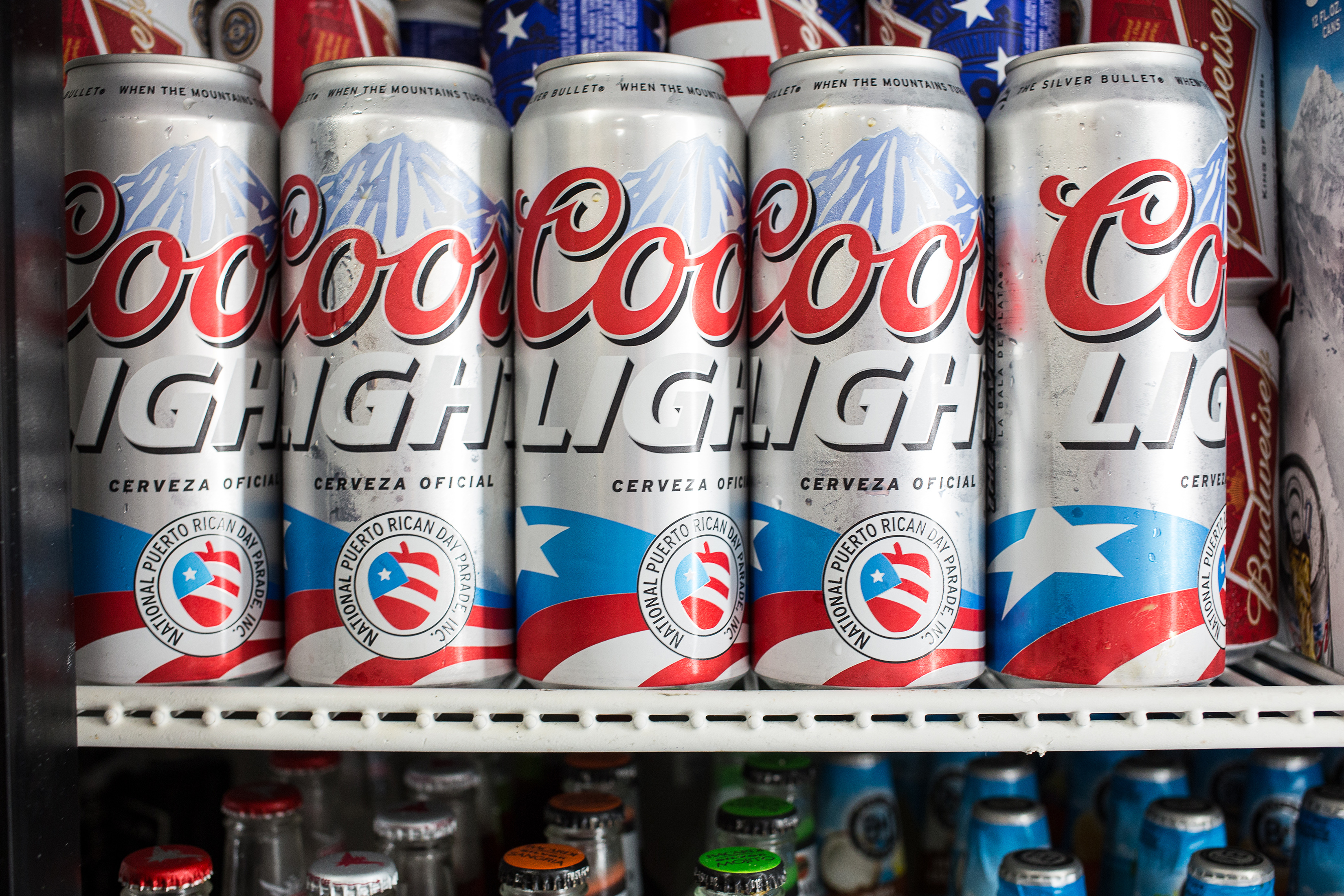 Coors aluminum beer cans in the cooler of a bodega, in New York, May 30, 2013. The Trump administration blames China for the decline of aluminum production in the U.S., but some of America's largest aluminum companies operate in Iceland. (Uli Seit/The New York Times)