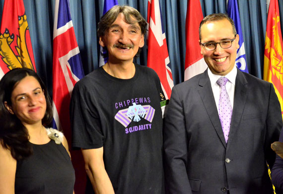 Jerry Natanine, the former mayor of Clyde River, with Farrah Khan of Greenpeace Canada (left) and Clyde River's lawyer, Nader Hasan, at a press conference held July 26 in Ottawa. (Jim Bell / Nunatsiaq News)