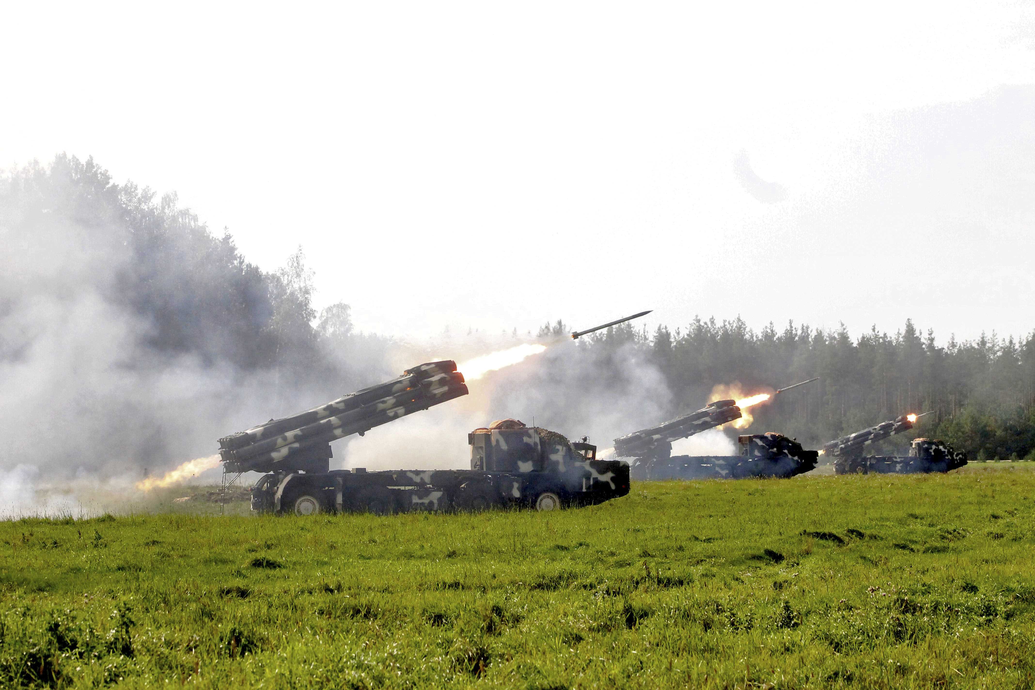 Multiple rocket launcher systems fire during the Zapad-2017 war games, held by Russian and Belarussian servicemen, at an undisclosed location in Belarus, September 17, 2017. Vayar military information agency/Belarussian Defence Ministry/Handout via REUTERS