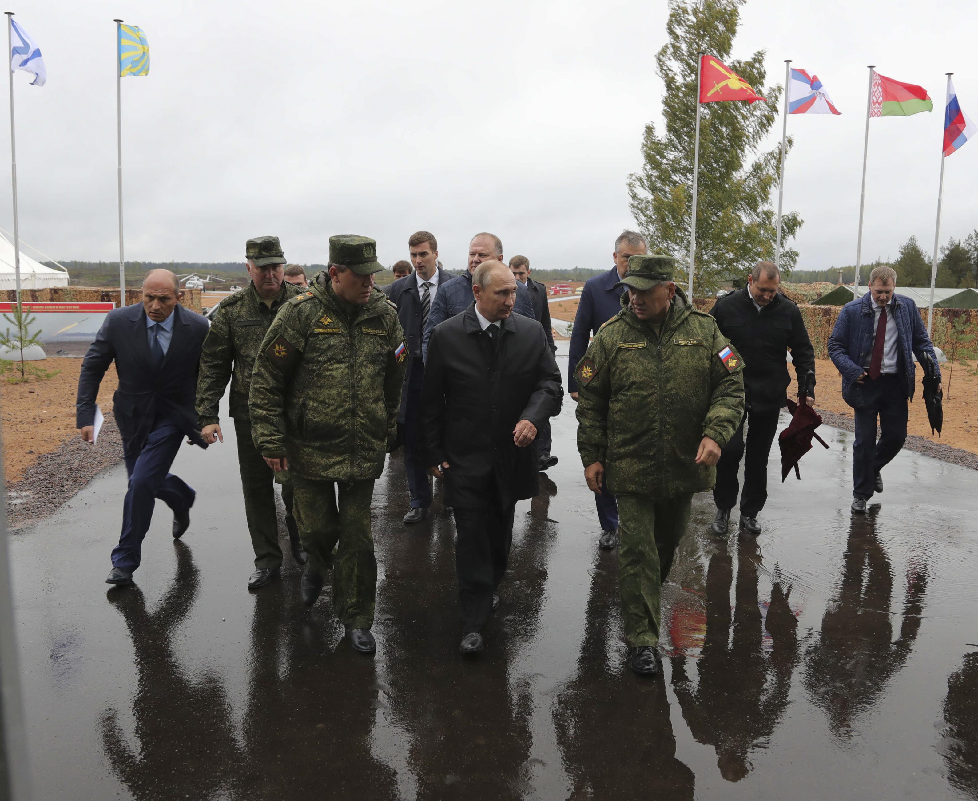 (R-L, front) Russian Defence Minister Sergei Shoigu, President Vladimir Putin and Chief of the General Staff of Russian Armed Forces Valery Gerasimov visit a military training ground to watch the Zapad-2017 war games, held by Russian and Belarussian servicemen, in the Leningrad region, Russia September 18, 2017. Sputnik/Mikhail Klimentyev/Kremlin via REUTERS