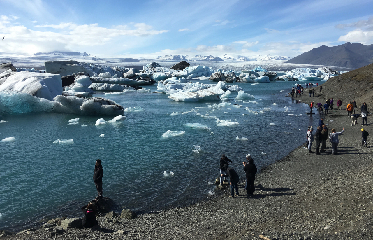 Tourists at the Jokulsarlon, a glacier lagoon in southern Iceland where ice bergs breaking off from the Breidamerkurjokull glacier have formed the country’s deepest lake in the last 80 years, on 4 July 2017. (Thin Lei Winn / Thomson Reuters Foundation)