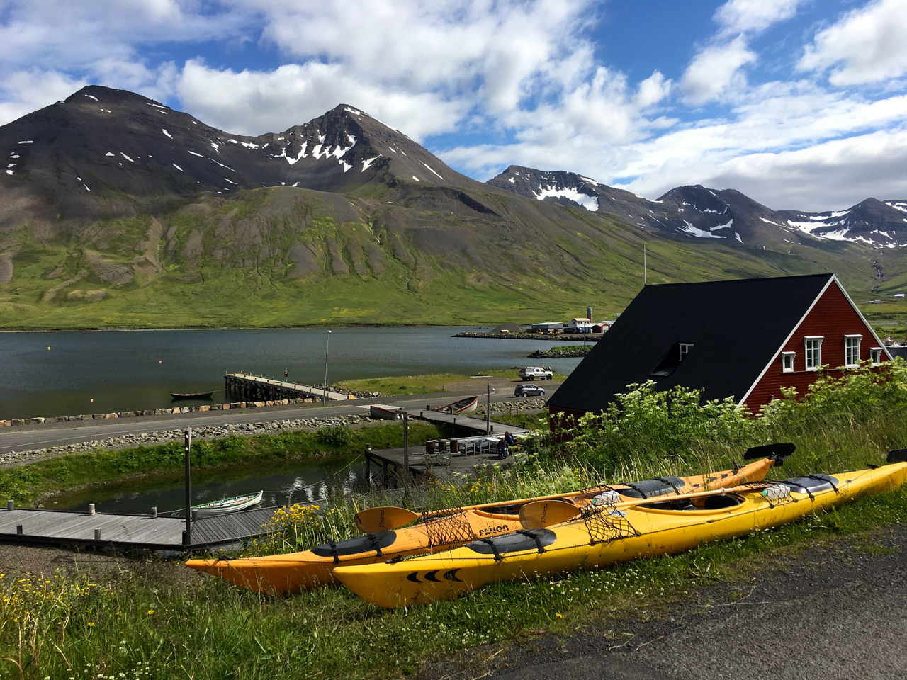 Kayaks on a hill overlooking a roof of the award-winning Herring Era Museum at Siglufjordur, northernmost town of mainland Iceland and once the country’s herring capital, on 7 July 2017. (Thin Lei Win / Thomson Reuters Foundation)
