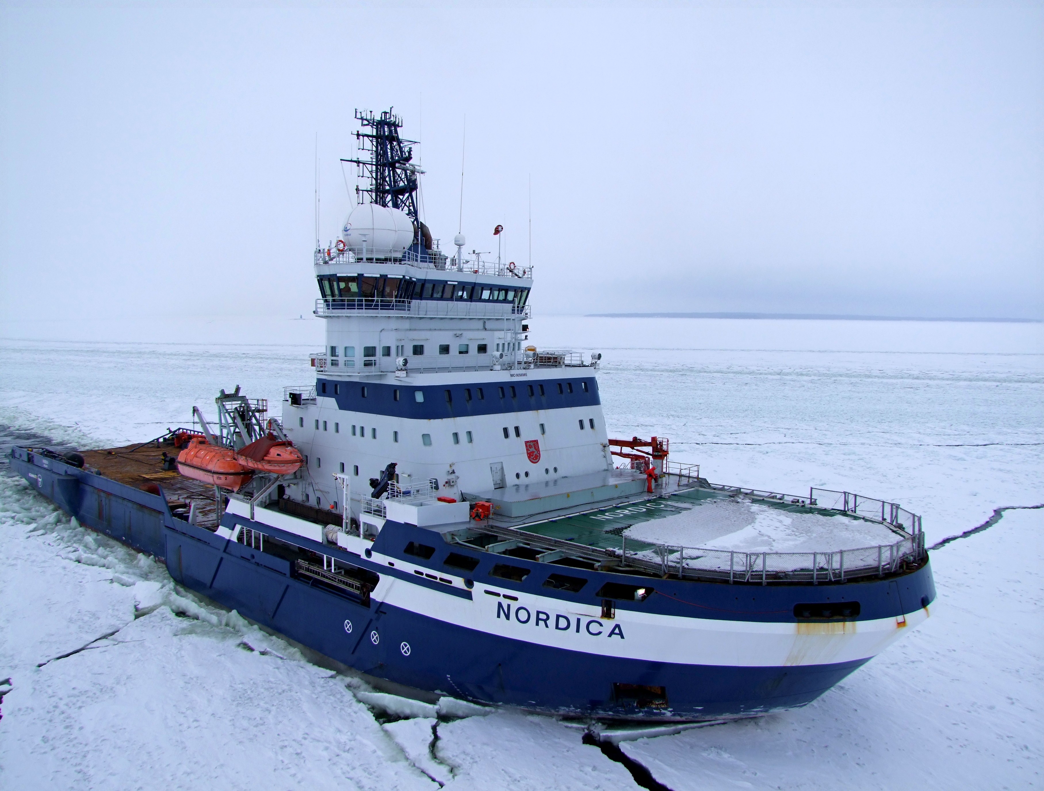 Arctia Ltd. icebreaker Nordica assisting a merchant ship near Hamina, Finland, on February 2009. (Cornelia Klier / CC via Wikimedia Commons)