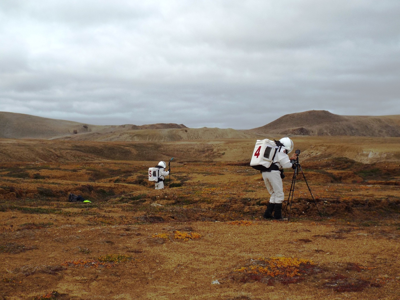 Yusuke Murakami (left) and Paul Knightly (right) carrying out photographic surveys on polygons in Haughton crater. (Jonathan Clarke)