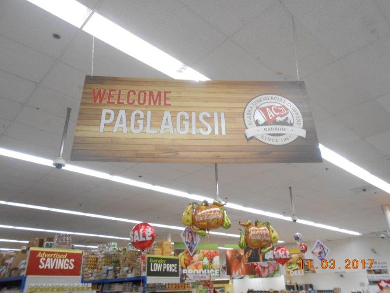A sign in the Utqiagvik (formerly Barrow) AC store welcomes shoppers in English and Iñupiaq. (North West Company)