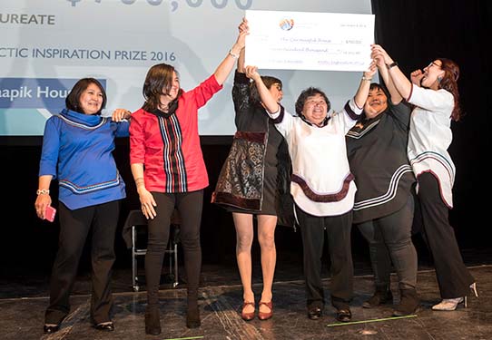 Qarmaapik House project leaders celebrate their Arctic Inspiration Prize win at the organization's December 2016 gala in Winnipeg. The Kangiqsualujjuaq-based Qarmaapik House won the AIP’s top prize of $700,000 for its family-focused centre, which offers health and social services, parenting support and crisis intervention. (Nunatsiaq News file photo)