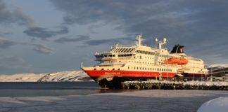 Hurtigruten puts Arctic cruise operations on hold, but two ships will sail supplies