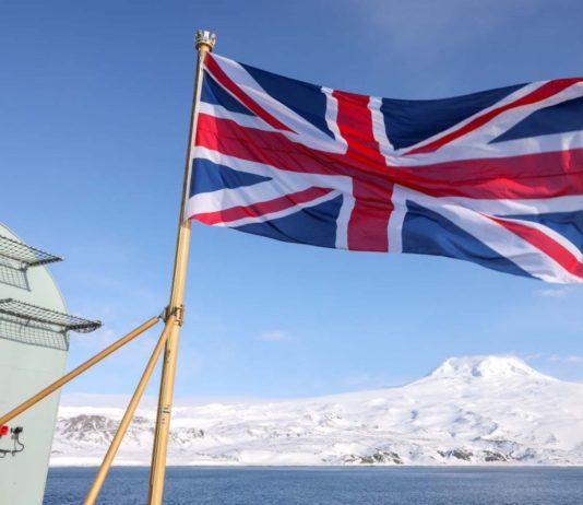 A British aircraft carrier makes a rare visit visit remote island in the Norwegian Arctic